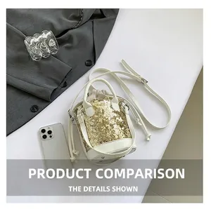 Detailed view of a gold sequin bucket bag with white leather trim and drawstring closure