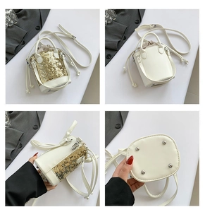 Detail view of mini sequin bucket bag showing leather base and drawstring closure