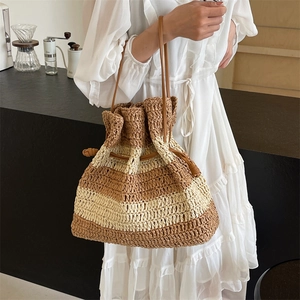 Striped French straw tote bag with brown leather drawstring for summer beach vacation