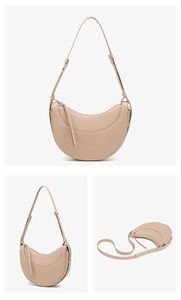 Detail of minimalist crescent PU handbag featuring cross-grain texture and adjustable strap
