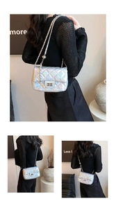 Close-up of laser finish quilted crossbody bag with metal twist lock and chain strap