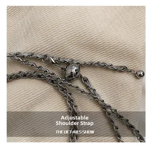 Detailed macro of the silver metal chain strap with adjustable spherical ball slider