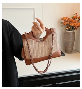 Close-up of vintage bucket bag featuring woven straw panels and brown lychee leather