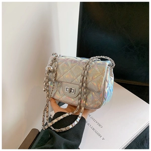 Detail of silver laser quilted crossbody bag with metal chain and adjustable ball buckle