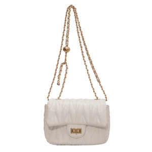 Chic cream quilted crossbody bag with gold chain strap and elegant metal twist lock
