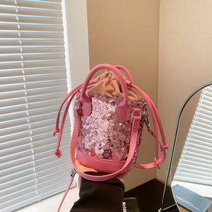 Chic pink sequin bucket bag with drawstring liner and adjustable chain shoulder strap