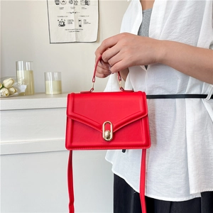 Red crossbody handbag for women with gold clasp and elegant smooth leather finish