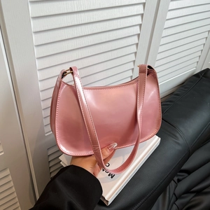 Minimalist pink patent leather hobo bag with adjustable strap for women in daily style