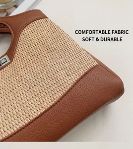 Detail of woven straw bucket bag with brown leather trim and silver metal twist lock