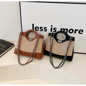 Close-up of woven bucket bags featuring leather trim, round handles and silver chain straps