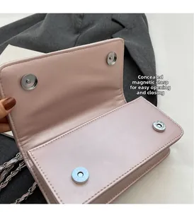 Detailed close-up of pink quilted bag featuring dual invisible magnetic closures