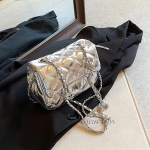 Silver laser metallic quilted chain bag with turn-lock closure and leather strap