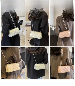 Detail view of quilted chain bag in pearl white, champagne gold, and soft pink shades
