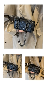 Detail of black quilted chain bag featuring silver strap and white brand logo text