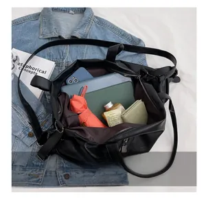 Spacious black tote bag showing organized interior storage for tablet and essentials