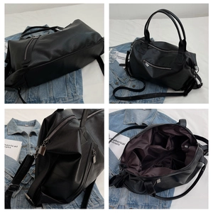 Detailed interior and textured leather of a large black faux leather tote with multiple pockets
