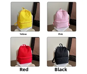 Detail view of large nylon backpack available in yellow, pink, red, and black colors