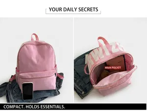 Pink nylon backpack detail showing spacious interior capacity for daily essentials