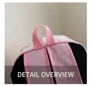 Close-up of pink and black nylon backpack featuring breathable mesh and reinforced stitching