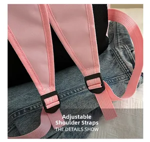 Close-up of adjustable pink straps and breathable mesh back on the backpack