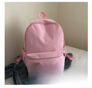 Detailed comparison showing pink canvas backpack size next to a smartphone