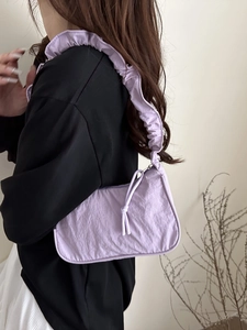 Chic light purple pleated shoulder bag with trendy cloud-style strap and ruched detail