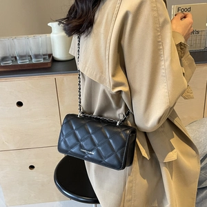 Classic black quilted crossbody bag with metal chain strap and fashion lettering