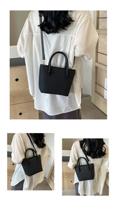 Détails de sac en cuir noir avec ferrures dorées et texture à grain fin élégante