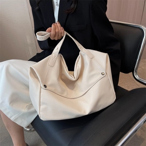 Fashionable ivory large capacity faux leather tote bag with vintage metal rivet detail