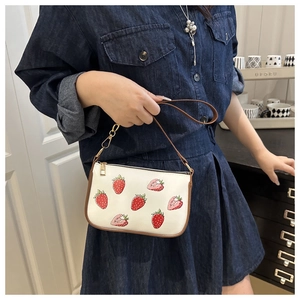 White PU leather strawberry handbag for women with brown trim and gold zipper