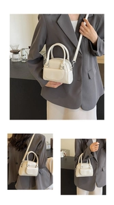Detailed views of a cream Boston bag with silver hardware and adjustable shoulder strap