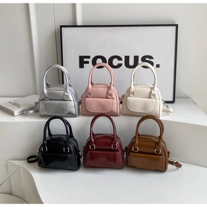 Chic shell-shaped faux leather handbags in multiple colors with top handles and straps