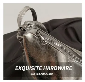 Detail view of silver textured tote bag featuring premium metallic zipper and minimalist puller