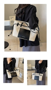Detailed macro view of woven tote bag with leather pocket and side drawstring details