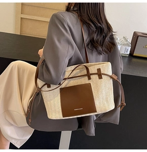 Detail of woven tote bag with brown leather pocket and drawstring in a lifestyle setting