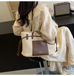 Detail of woven tote bag with leather pocket and drawstring closure for beach vacation