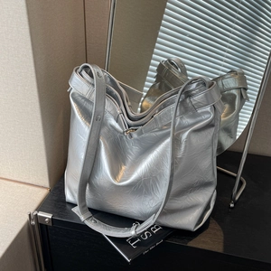 Metallic silver tote bag with crinkled texture and spacious design for women fashion