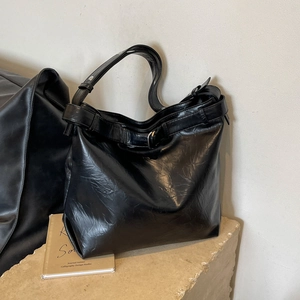 Large capacity black hobo bag with pleated texture and adjustable buckle strap