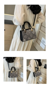 Lifestyle view showing the textured grey square handbag with detachable black shoulder strap