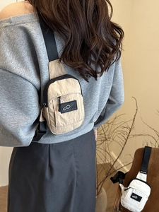 Minimalist nylon crossbody phone bag in khaki and white for casual outdoor daily wear