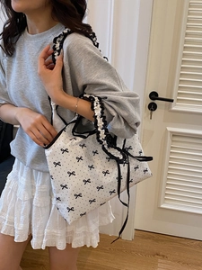 Sweet polka dot canvas tote bag with black bows and ruffled straps for summer