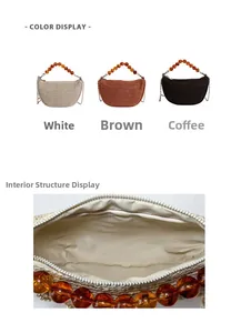 Detail view of woven straw handbags with amber bead handles and metal chain straps