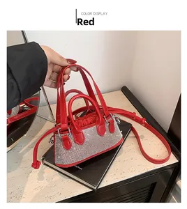 Detail showing red rhinestone mini bag with shimmering crystals and elegant handle
