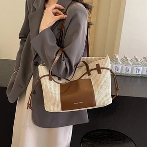 Large woven tote bag with brown leather trim and handles for women's beach vacations