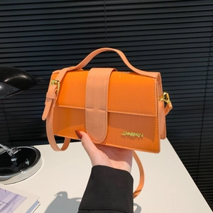 Fashionable orange crocodile pattern crossbody bag with top handle and metal logo