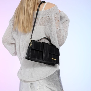 Fashionable black quilted crossbody bag for women with gold logo and textured leather finish