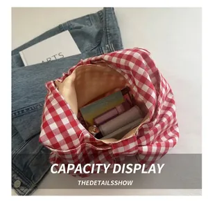 Top view of red plaid tote bag interior showing spacious capacity for cosmetics and items