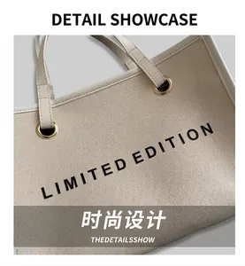 Detail view of large canvas tote bag with Limited Edition print and gold metal eyelets