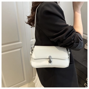 Chic white rectangular PU leather underarm bag with silver buckle worn by a model