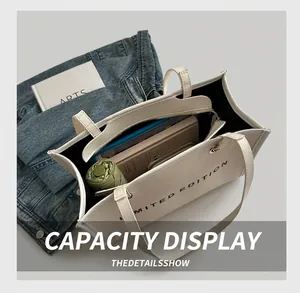 Internal view of the white canvas tote showing spacious storage for daily essentials